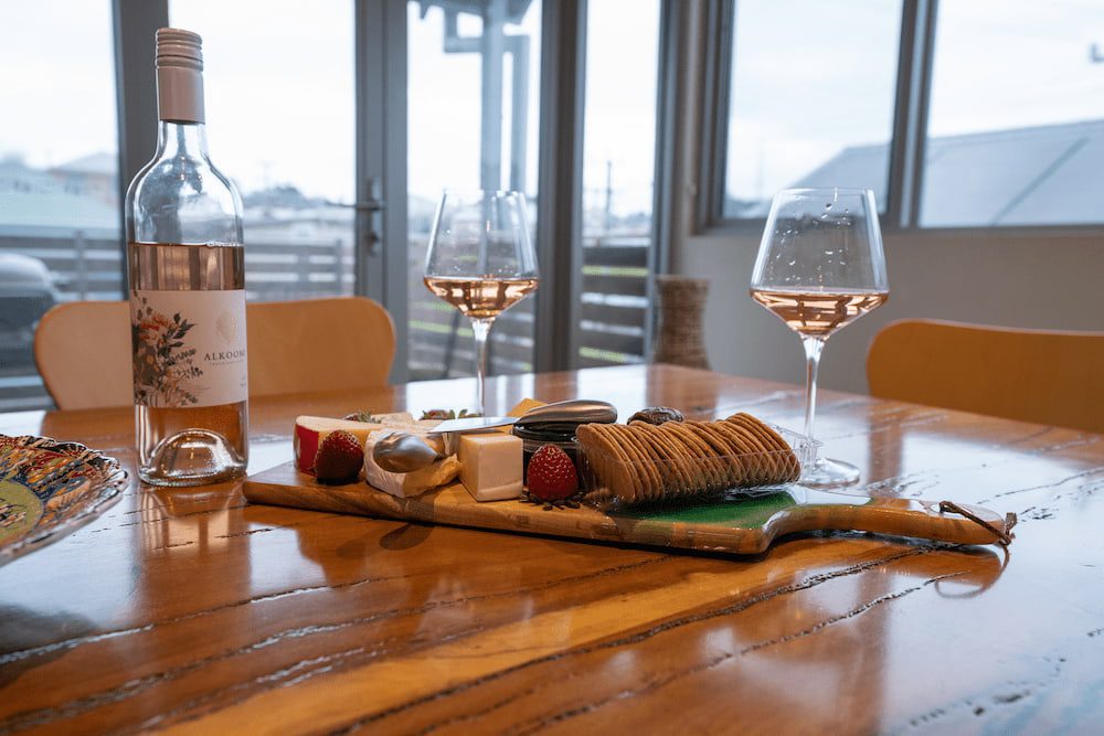 Wine and a cheese platter on the dining table of the Vancouver apartment.