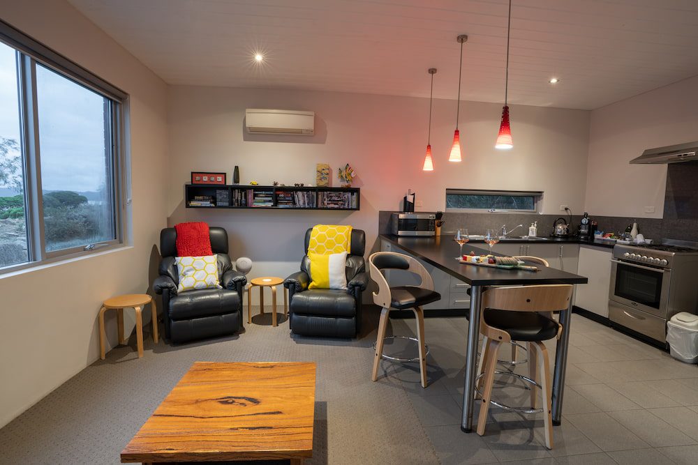 The lounge of the York with coffee table and two recliner chairs.