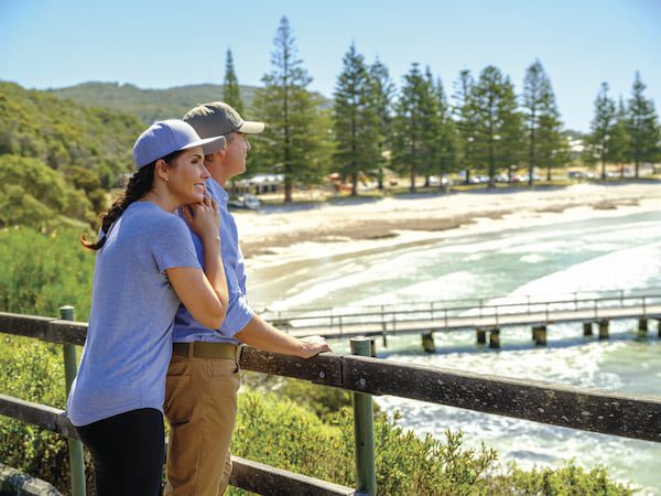 A couple enjoying the view of Middletone Beach from the walkway.